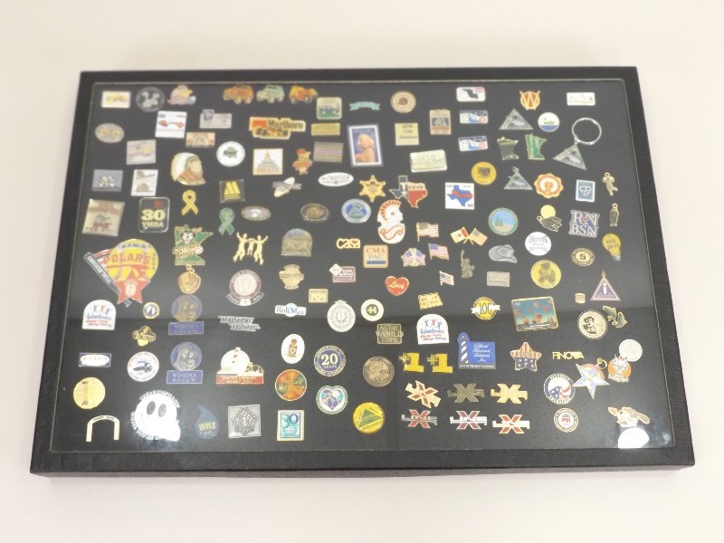 lot 26 image: Collection of Pins in Glass Top Display Case