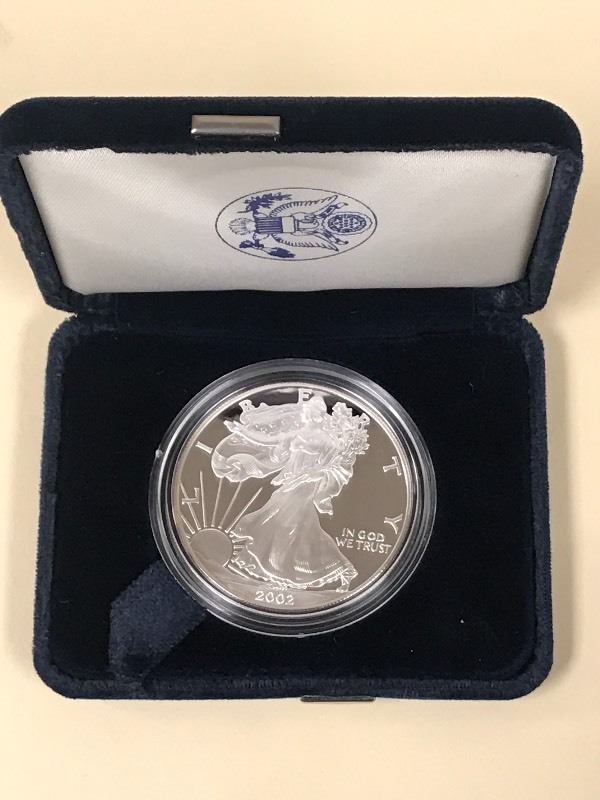 lot 44 image: 2002-W Silver American Eagle Dollar...