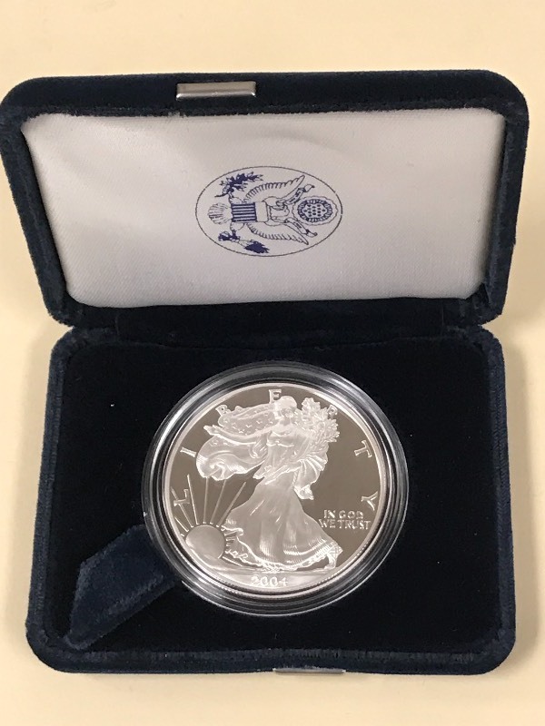 lot 46 image: 2004-W Silver American Eagle Dollar...