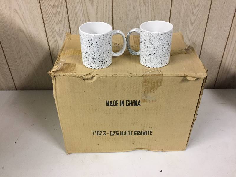lot 29 image: 34 New Black White Mugs