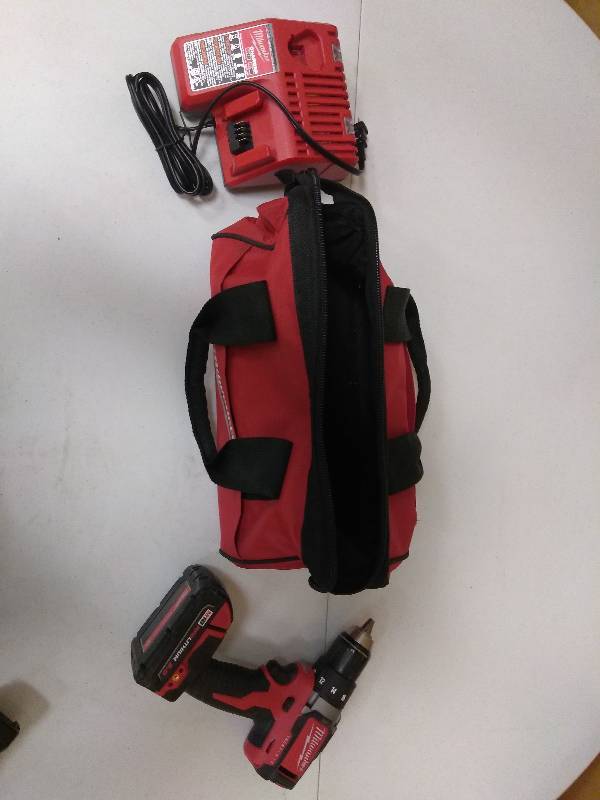 lot 28 image: Milwaukee M18 18-Volt Lithium-Ion Brushless Cordless 12 in. Compact DrillDriver Kit W (1) 2.0Ah Battery, Charger & Tool Bag