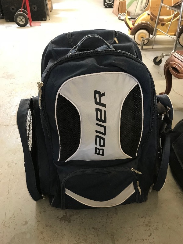 lot 824 image: ROLLING SPORTS BAG  WITH SKATES AND BOOTS