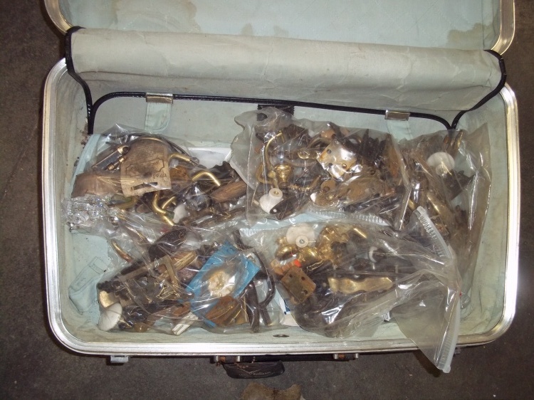 Suitcase full of vintage Door hardware including hinges and handles
