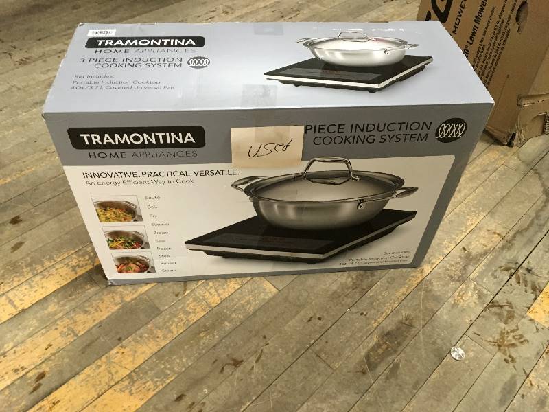 lot 99 image: Tramontina 3 Piece Portable Induction Cooking System used in like new condition