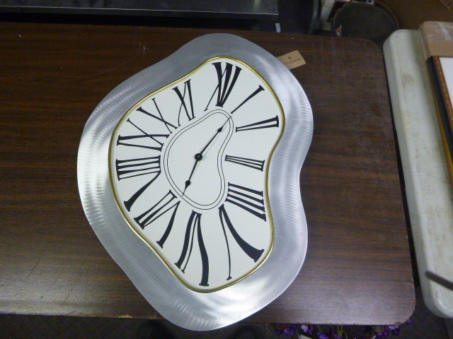 lot 94 image: Odd Shape Clock Wall Hanger