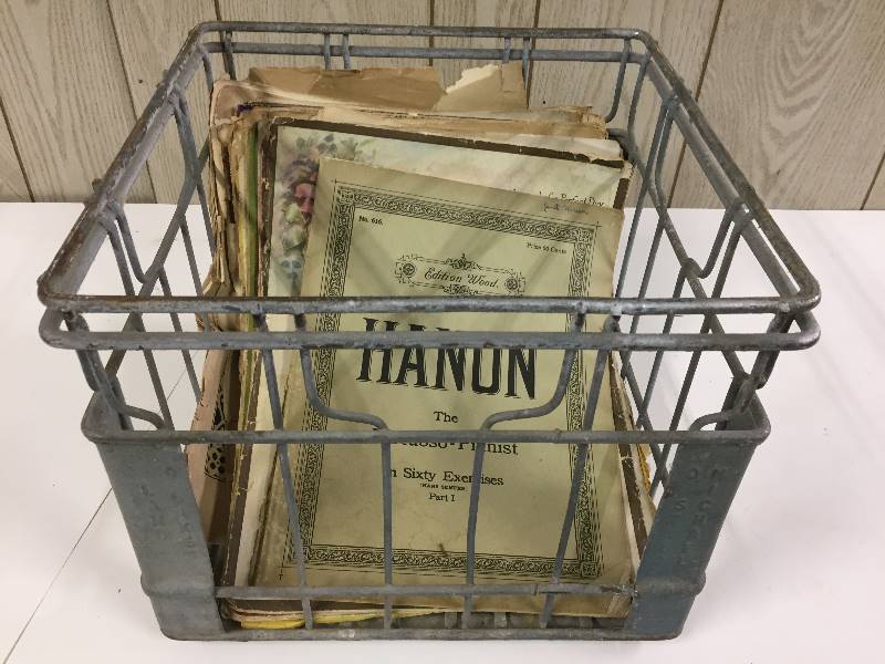 lot 86 image: Metal Milk Bottle Case with Vintage Sheet Music