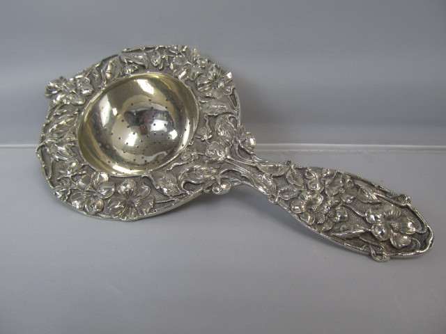 lot 7 image: Antique Sterling Silver Repousse Tea Strainer