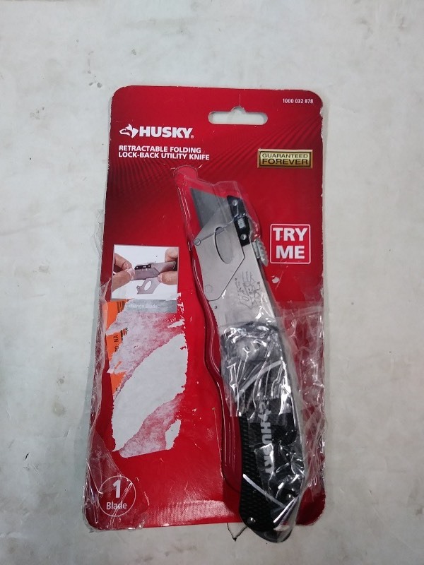 lot 15 image: -Husky retractable folding utility knife