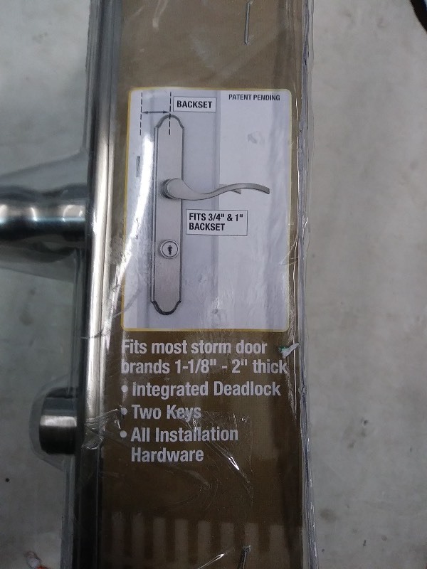 lot 34 image: Wright Products Storm Door with locking handle VMT115SN