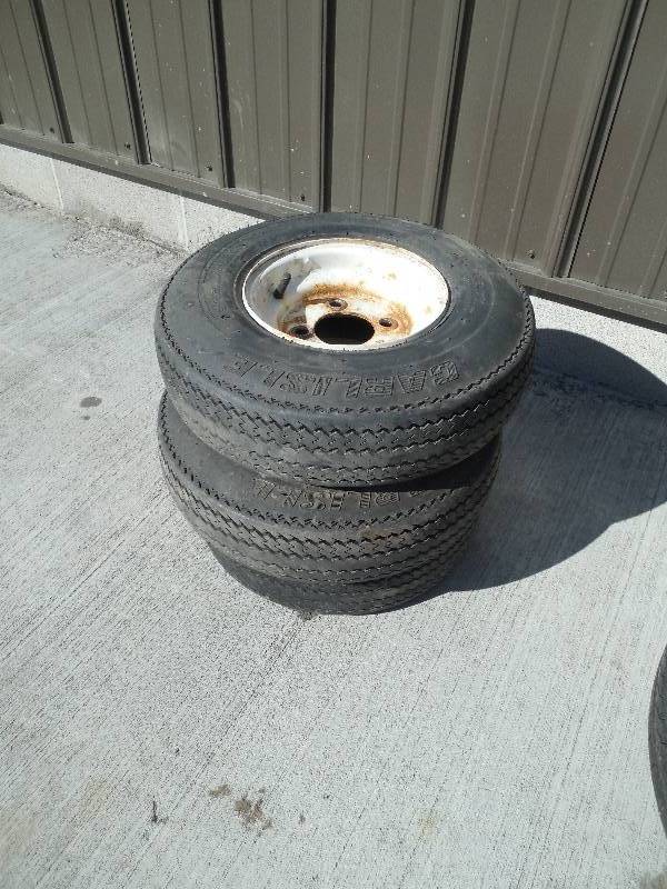 lot 69 image: (3) 4 BOLT RIMS AND TIRES