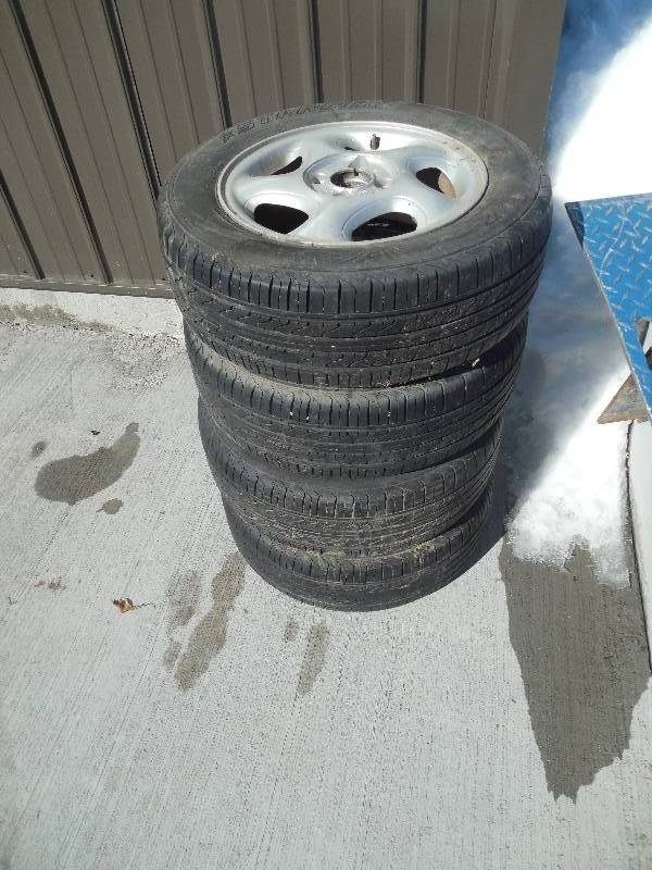 lot 70 image: SET OF 4 MATCHING RIMS AND TIRES