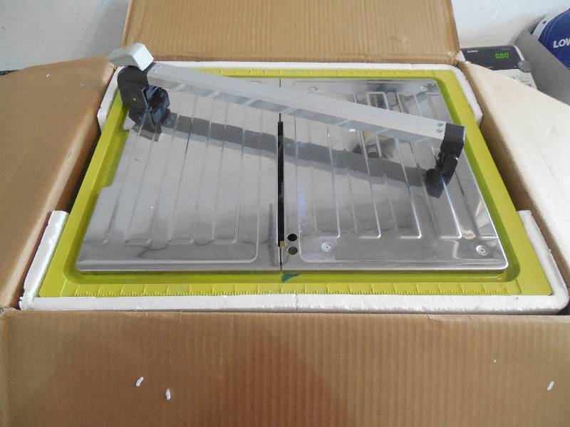 lot 6 image: Ryobi 7 in. 4.8 Amp Tabletop Tile Saw