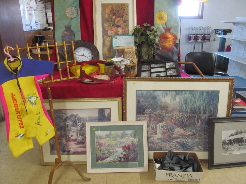 lot 59 image: floral pictures, wetsuit, candles, safety harness, Fisher Price Construx, plate, jar, pail