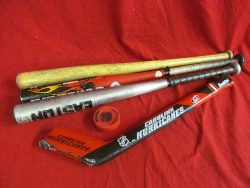 lot 78 image: bats, hockey stick, puck