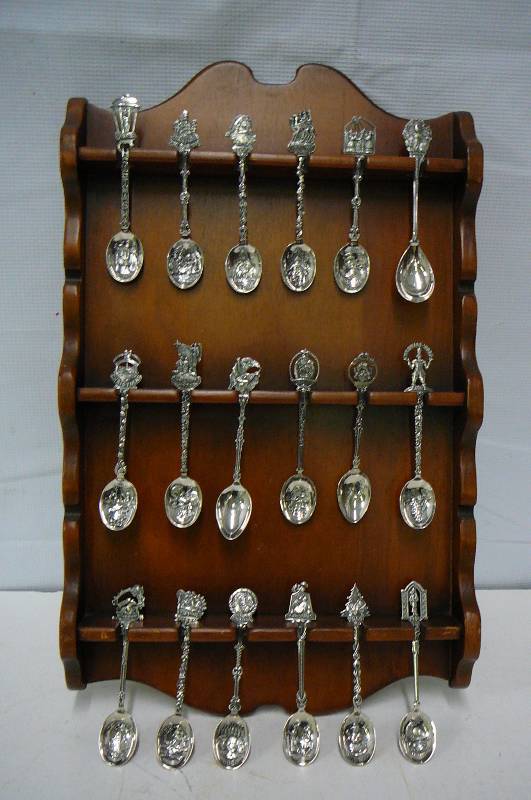 lot 11 image: Christmas spoons and rack silver plate 16 count 1979-1994