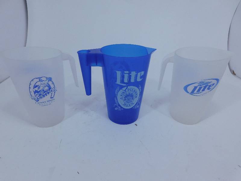 lot 43 image: 3 Miller Lite Plastic Pitchers