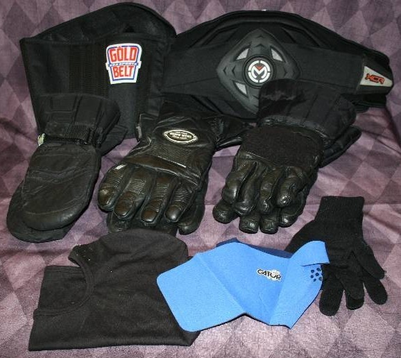 lot 34 image: Snow Mobile Gloves, Masks, and Back Braces