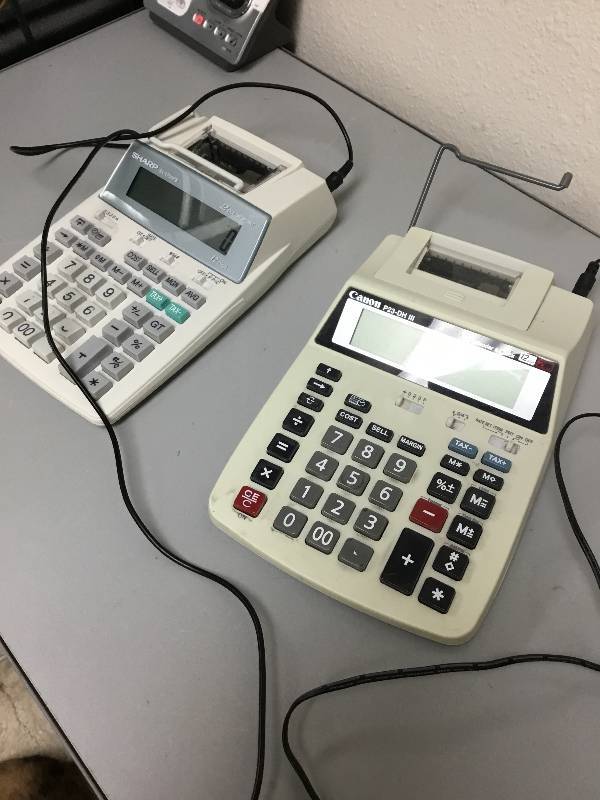 Sharps EL-1750Plll and a Canon - P23-DH lll - Calculator & Calendar and Clock