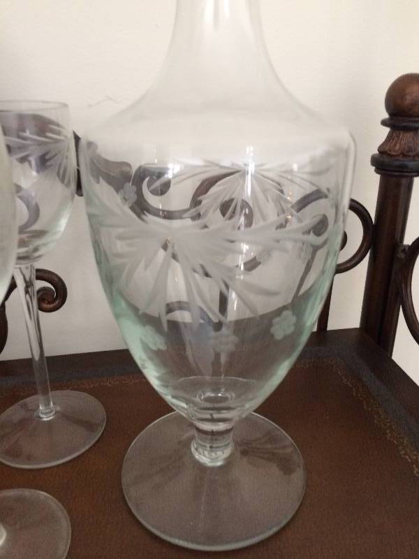 lot 41 image: Beautiful Vintage Etched Glass Wine Decanter Set With 6 Etched Wine Glasses  Goblets - Has a slight Greenish Cast To Glass - Excellent Condition - No Chips Cracks Or Scratches A Little Dusty...