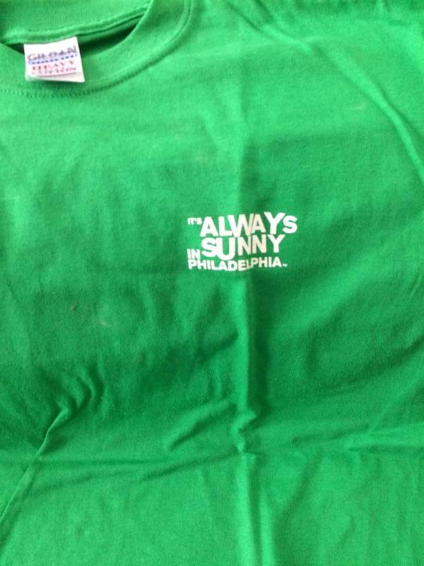 lot 174 image: NEW Actors Signed T Shirt Its Always Sunny in Philadelphia autographs - Danny DeVito - above the word Paddys Charlie Day (bottom row, left), Kaitlin Olson (bottom row, middle), & Glenn Howerton bottom row, right