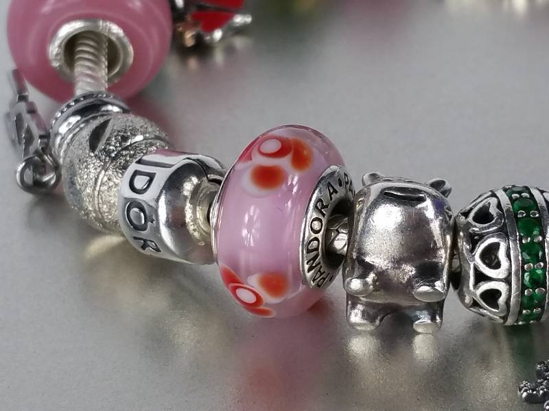 lot 23 image: Pandora Bracelet with 25 Charms and Pandora Box - $2390 Retail