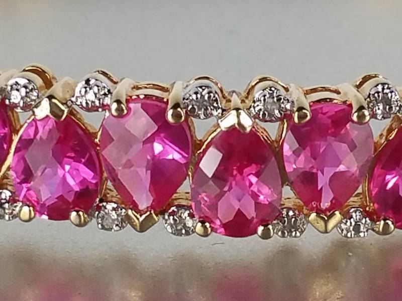 lot 30 image: 5 ct Ruby and Diamond Bangle Bracelet