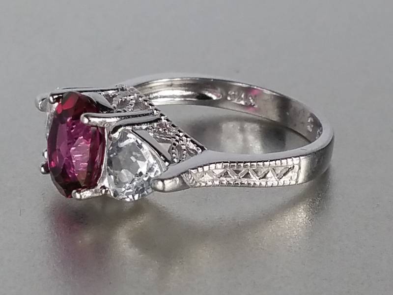lot 99 image: Ruby and White Sapphire Ring