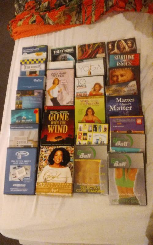 lot 25 image: Large Assortment Of DVDs Workout, Box Set & Religious