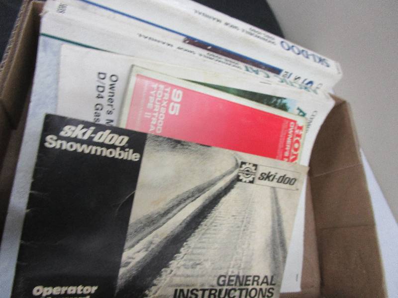 lot 40 image: Car Books, Honda, Harley, ski-doo, Artic Cat