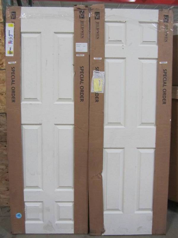 lot 20 image: JELD-WEN 28 in. x 80 in. Colonial Primed Textured Solid Core Molded Composite MDF Interior Door Slab (x2)