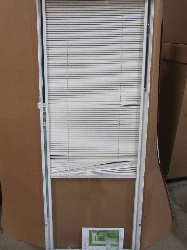 lot 27 image: ODL 0.59-in Cordless White Aluminum Light Filtering Door Blinds Mini-Blinds (Common 25-in Actual 24.75-in x 64-in)