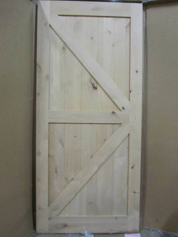 lot 44 image: Steves & Sons  36 in. x 80 in. 2-Panel Solid Core Unfinished Knotty Alder Interior Barn Door Slab