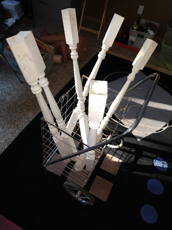 lot 83 image: White Wood Balusters (6) and Antique Wire Shopping Cart