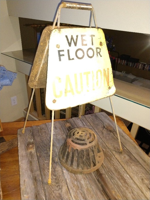 lot 87 image: Cast Iron Roof Drain and Vintage Wet Floor Caution Sign