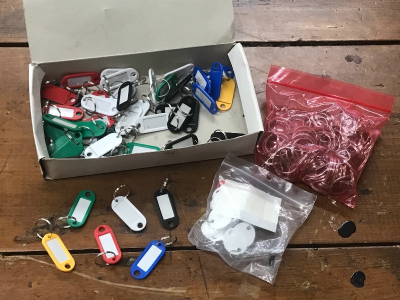 lot 46 image: Box Full Of Assorted Colored Key Ta...