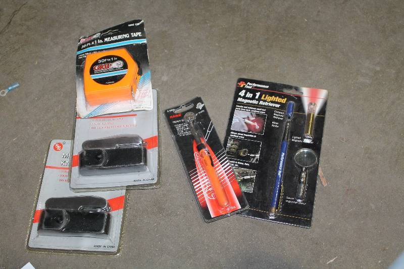 lot 125 image: Lot of (5) Hand Tools - Grip 30ft. Measuring Tape, Performance Tool 4-in-1 Lighted Magnetic Retriever, Multi-Function Knife, Hawk Heavy Duty Grip Tool