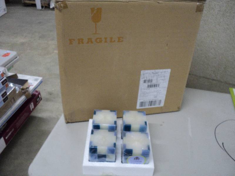 lot 139 image: Case of 24 Home Trends candles...