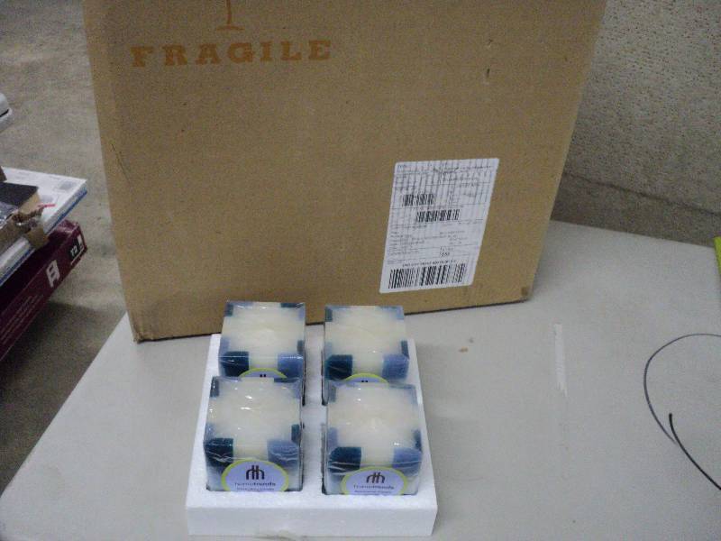 lot 140 image: Case of 24 Home Trends candles...