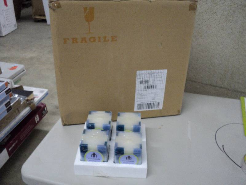 lot 141 image: Case of 24 Home Trends candles...