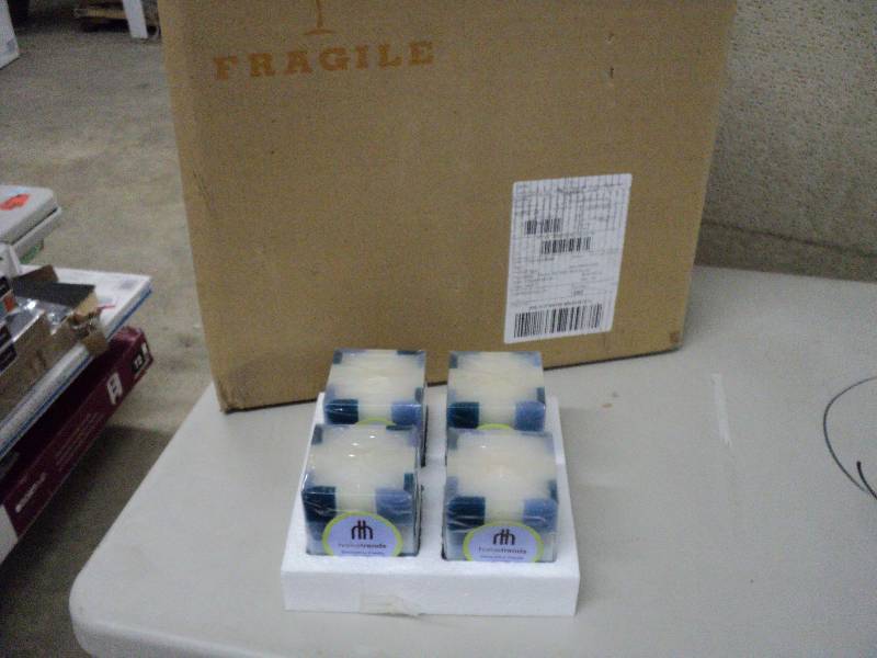 lot 142 image: Case of 24 Home Trends candles...