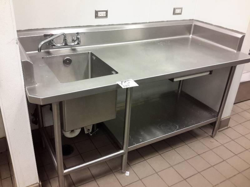 lot 15 image: Stainless Work Bench with Sink on one end.. Has Shelf and cutting board stowage with cutting board included