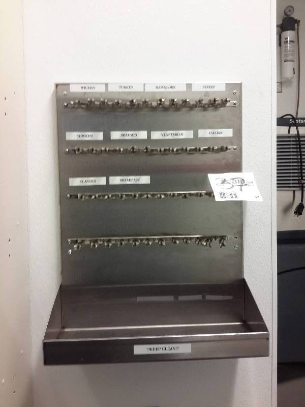 lot 37 image: Stainless steel Organizing shelf.. Not really sure what they were organizing