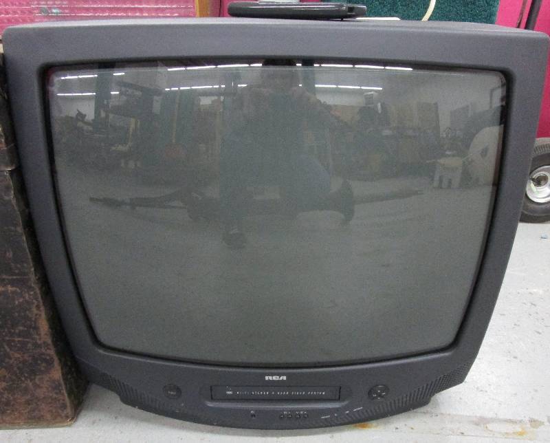 lot 21 image: 21 Tv with VHS Player Tested and Works