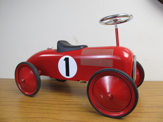 lot 32 image: NICE Metal Ride-On Race Car