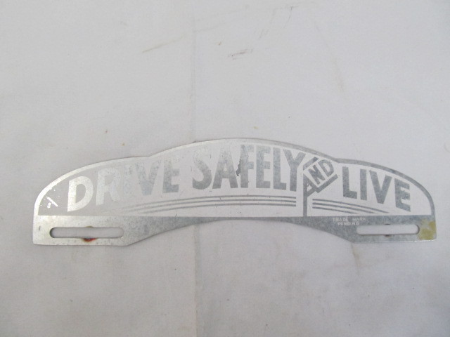 lot 106 image: Vintage License Topper Drive Safely & Live