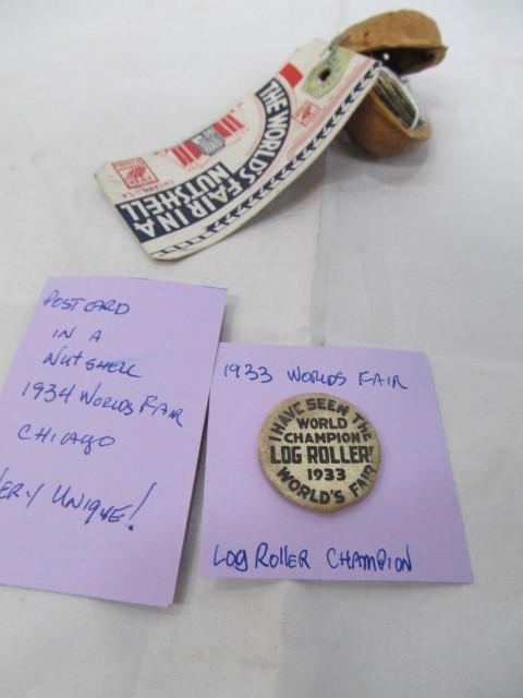 lot 135 image: 1933&34 Worlds Fair Items- Champion Pinback & Post Card in a Nut Shell