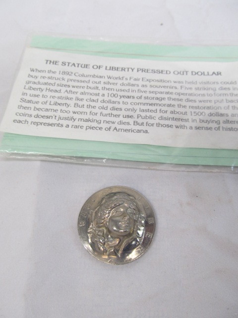 lot 311 image: 1978 Liberty Eisenhower Pressed Out Silver Dollar