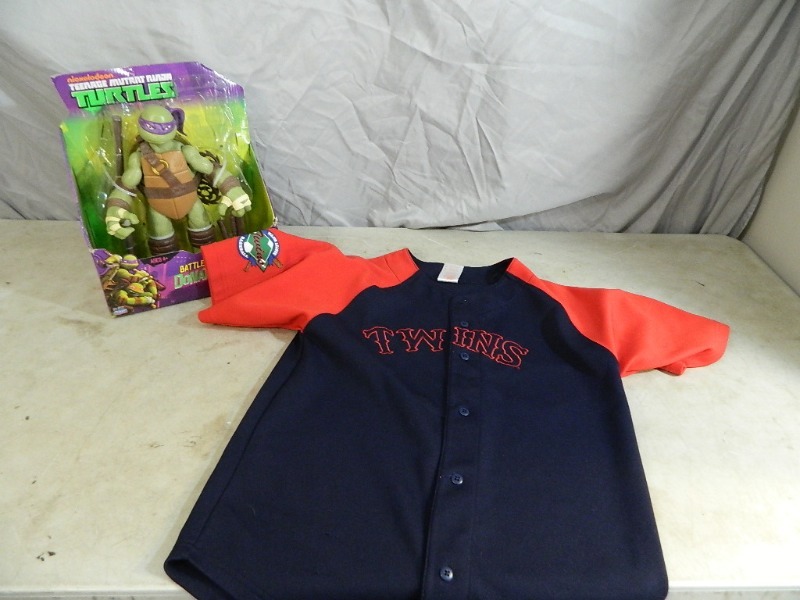 lot 42 image: New TMNT Toy and MN Twin Jersey