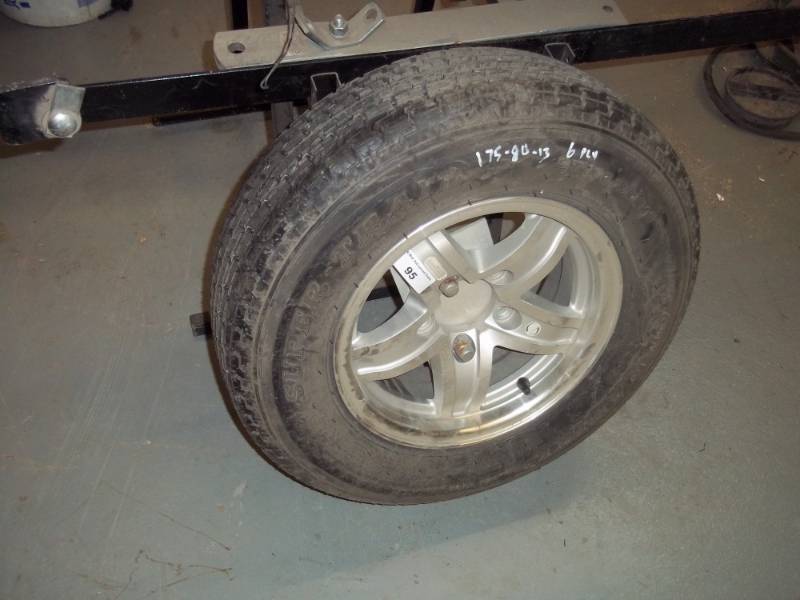 lot 95 image: Aluminum Rim with 175 - 80 - 13 Tire