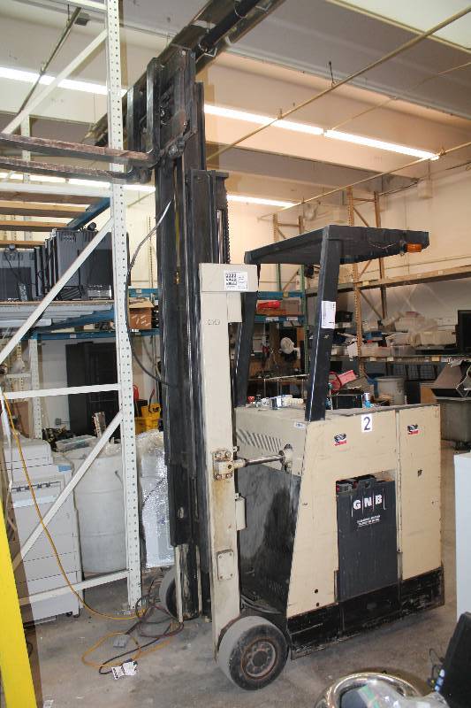 lot 1 image: Crown Fork Lift, Electric Stand Up Fork lift with Charger